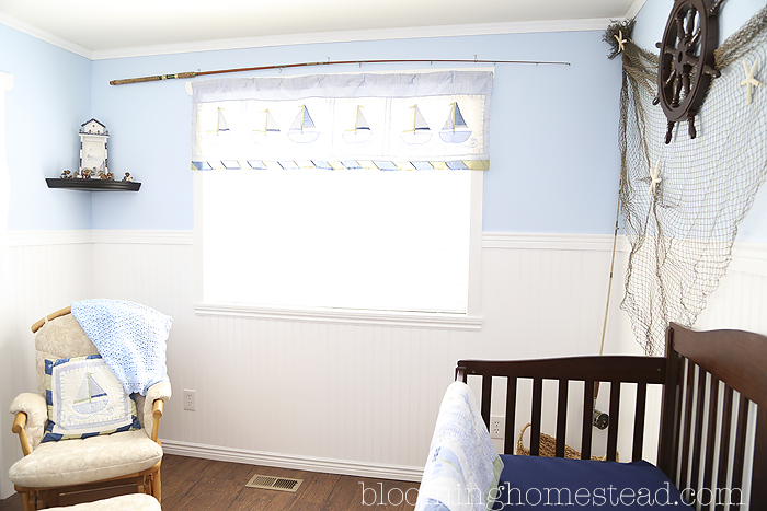 This adorable Nautical Nursery is so sweet. Ships and vintage fishing poles add such a fun addition.