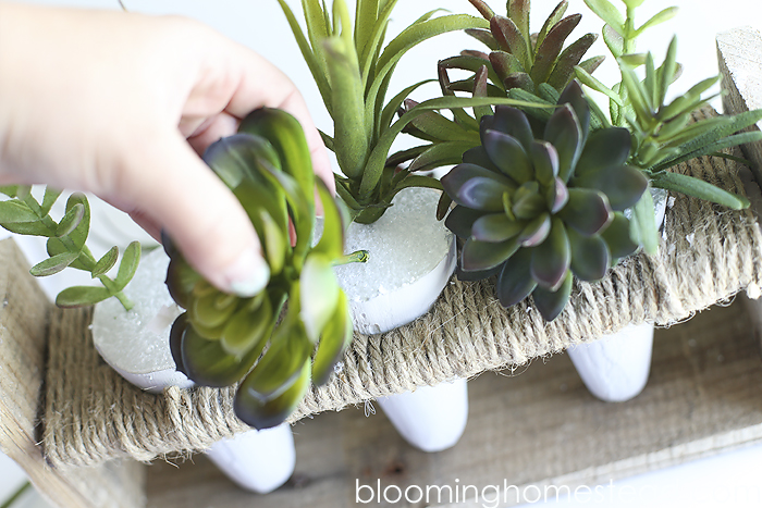These DIY Faux Concrete Planters are so easy to make. Plus the best faux succulents you can find.