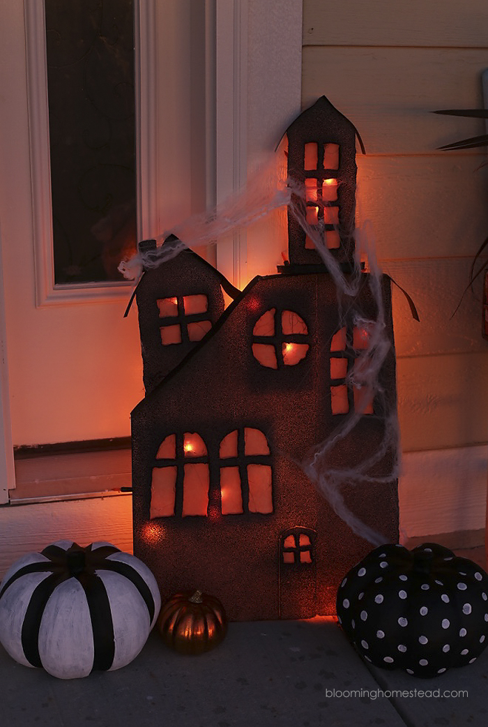 This diy lighted haunted house is so simple and easy to make, be sure to check out the full tutorial on www.bloominghomestead.com