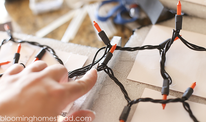 This diy lighted haunted house is so simple and easy to make, be sure to check out the full tutorial on www.bloominghomestead.com