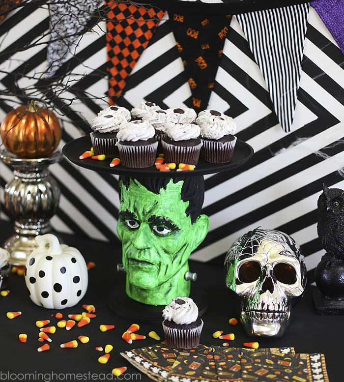 This fun Halloween Cake Plate or platter was made using foam heads available at the craft store! Super easy and fun way to serve goodies at a Halloween party or event.