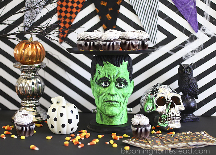 This fun Halloween Cake Plate or platter was made using foam heads available at the craft store! Super easy and fun way to serve goodies at a Halloween party or event.