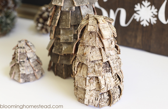 Beautiful DIY Rustic Christmas trees using birch bark. These are so easy and affordable to make and they look great too. Perfect for the holidays, winter, and would even be lovely all year long.