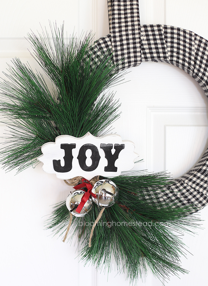 This diy Christmas Wreath is so pretty and is so easy to make. You can watch the video tutorial to learn how to make your own for the holidays!