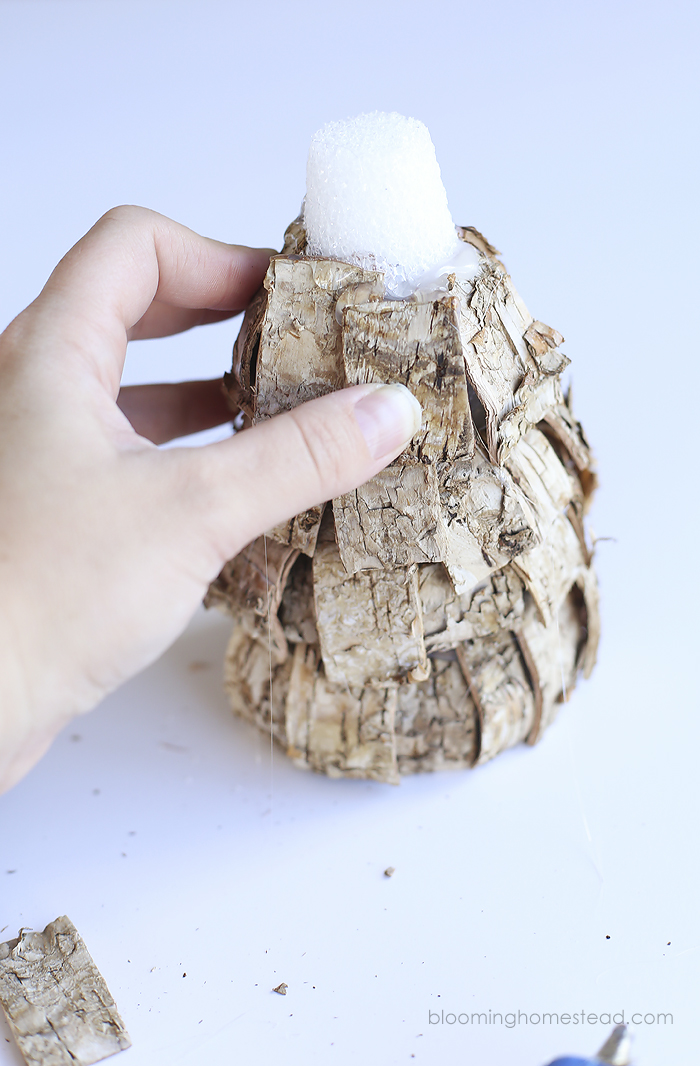 Beautiful DIY Rustic Christmas trees using birch bark. These are so easy and affordable to make and they look great too. Perfect for the holidays, winter, and would even be lovely all year long.