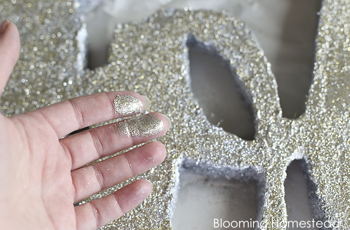 Easy to make diy glitter JOY sign using foam! Check out the full tutorial at Blooming homestead