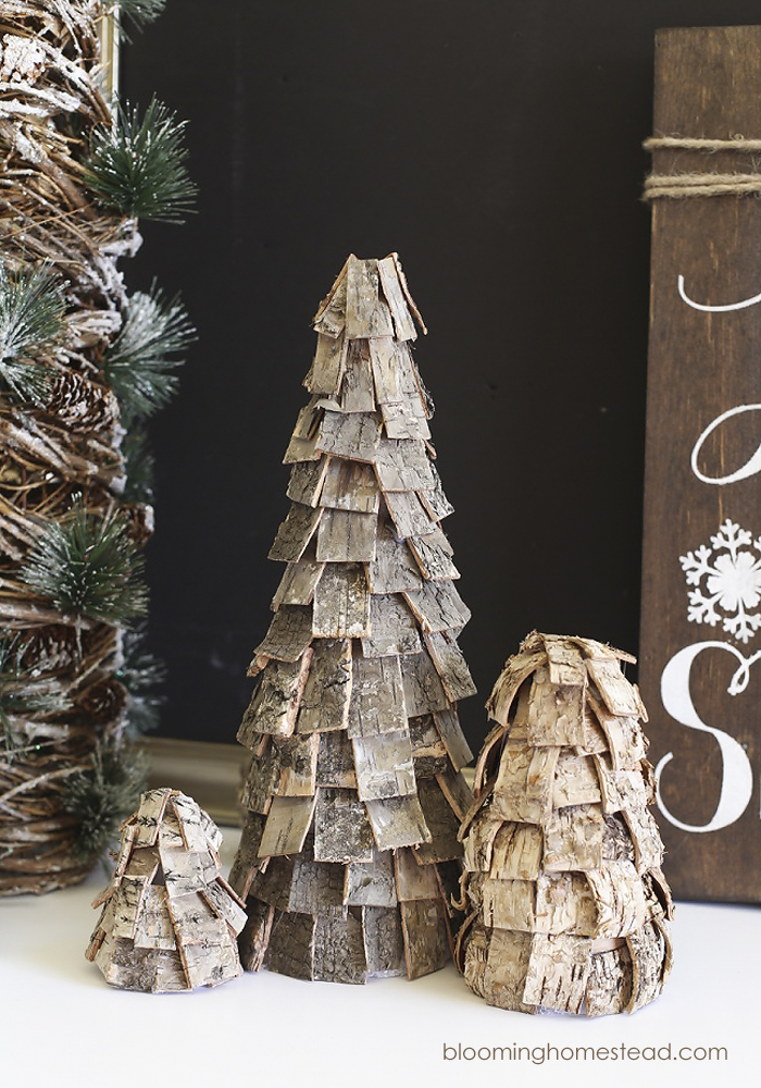 Beautiful DIY Rustic Christmas trees using birch bark. These are so easy and affordable to make and they look great too. Perfect for the holidays, winter, and would even be lovely all year long.