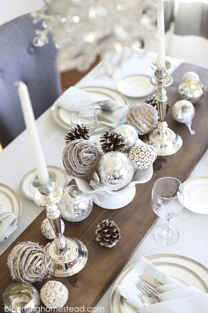 Beautiful winter tablescape featuring a metallic feel with rustic elements. Wouldn't this be a perfect Christmas Tablescape or for any holiday?