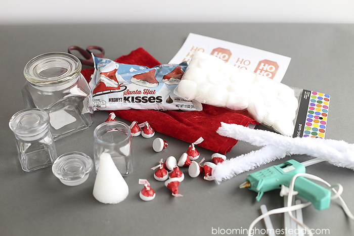 These Santa Hat Jars are so adorable, be sure to fill them with Hershey's Kisses Santa Hat Chocolates you can find at target. Such a fun gift idea or party favor.