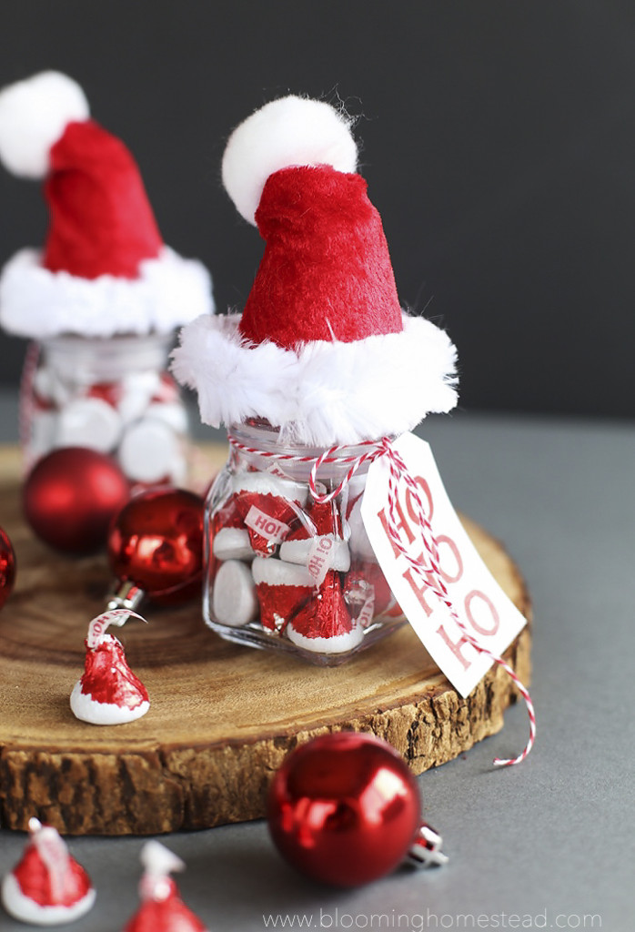 These Santa Hat Jars are so adorable, be sure to fill them with Hershey's Kisses Santa Hat Chocolates you can find at target. Such a fun gift idea or party favor.