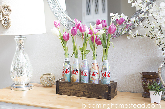 Easy Spring Centerpiece using upcycled Coca-Cola Bottles. Super cute!