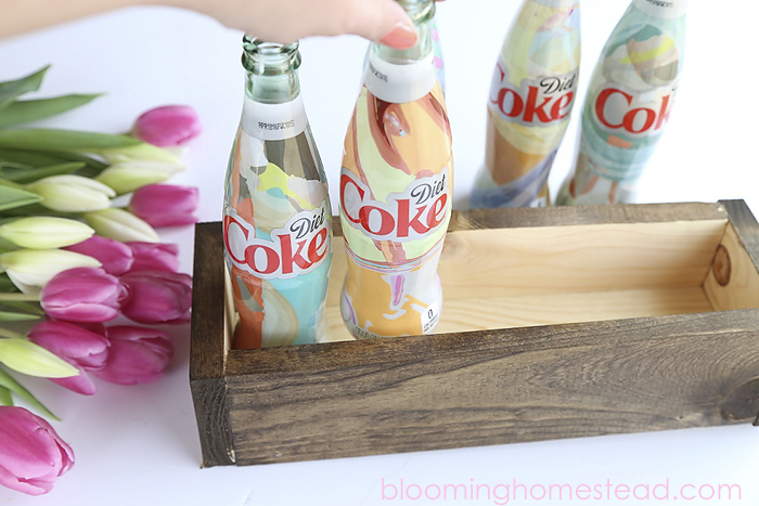 Easy Spring Centerpiece using upcycled Coca-Cola Bottles. Super cute!